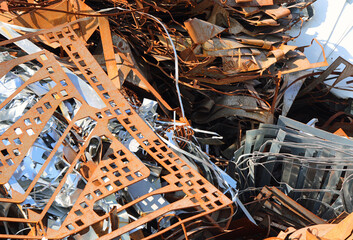 pile of rusted ferrous scrap in a landfill by a foundry