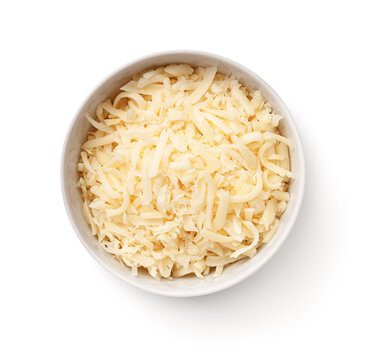 Grated Gouda Cheese In White Bowl Isolated