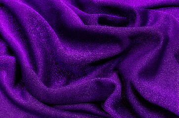 Beautiful elegant wavy violet purple satin silk luxury cloth fabric texture with violet background...