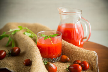 homemade freshly squeezed tomato juice with pulp in a glass decanter