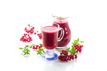 freshly squeezed thick natural juice with pulp from ripe red viburnum in a decanter