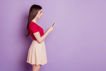 Profile portrait of stunning lady hold telephone browsing chatting on purple background