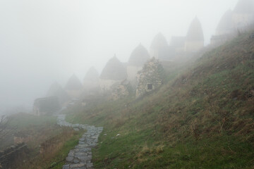 Dargavs, North Ossetia-Alania, Russia. City of the dead, ancient necropolis in the mountains of North Caucasus.  - 464269266