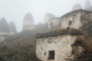 Dargavs, North Ossetia-Alania, Russia. City of the dead, ancient necropolis in the mountains of North Caucasus.  - 464269275