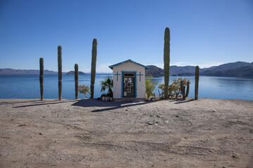 small pretty catholic church, beautiful in the desert, ocean view, cactus on the road, south america, mexico, california