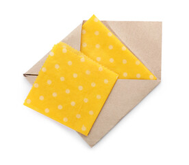 Yellow reusable beeswax food wraps on white background, top view