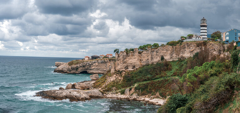 Lighthouse On The Rocks near Sile, Istanbul, Turkey, Black Sea. Lighthouse on rock near sea. Ocean coast with rocks and lighthouse. panorama