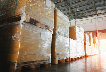 Package Boxes Wraaped Plastic Film on Pallets in Storage Warehouse. Supply Chain. Storehouse Cargo Shipment. Shipping Warehouse Logistics.	