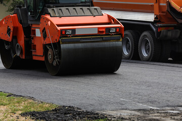 Modern roller on city street. Road repair service