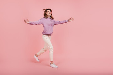 Fototapeta na wymiar Full size profile side photo of mature woman happy positive smile open arms look empty space welcome isolated pink color background