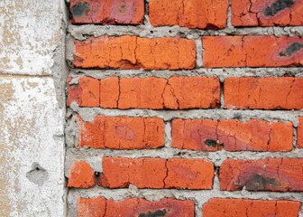 Dilapidated old red brick wall