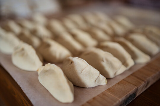 Raw jiaozi dumplings served on table