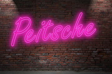 Neon BDSM whip (in german Peitsche) lettering on Brick Wall at night