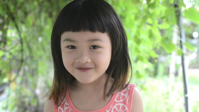 The girl was breathing fresh, filling her lungs in garden. To prevent the spread of the coronavirus.