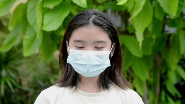 The girl was breathing fresh, filling her lungs while wearing a mask. To prevent the spread of the coronavirus.