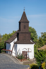 Old church of St. Martin on the street in ethnic village Holloko, Hungary
