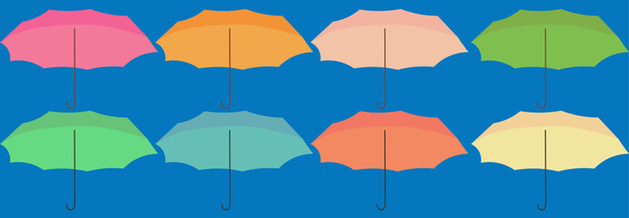 paraguas de varios colores en fondo celeste