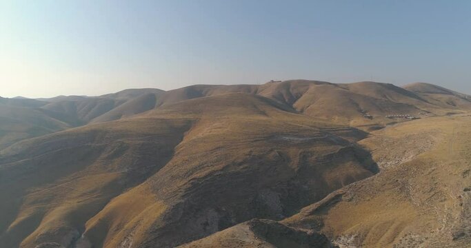 Panoramic view over mountain Judea and Samaria desert In South Israel. Top hill rock mountains blue sky and clouds landscape of the horizon with shadow terrain curves Judean Wilderness