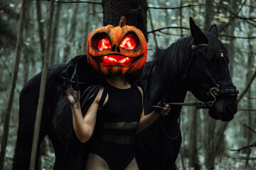 mask in the form of a pumpkin with burning eyes. creepy girl costume for halloween. wrap yourself...