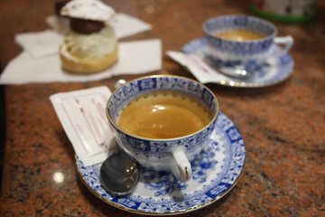 Fresh espresso coffee in elegant porcelain cups with blue pattern. Traditional pause italian lifestyle in Venice. Inspiration moment of aromatic magic.