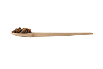 dried rose hip fruit in wooden spoon isolated on white background. Herbs and food ingredients.