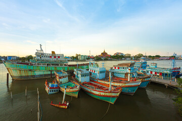 Many boats moored in sunrise morning time at Chalong port, Main port for travel ship to krabi and phi phi island, Phuket, Thailand