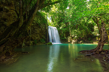 Fototapeta na wymiar beautiful waterfall A beautiful waterfall in a green forest at Kanchanaburi, Thailand.