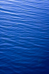 Obraz premium Blue water texture with ripples and waves