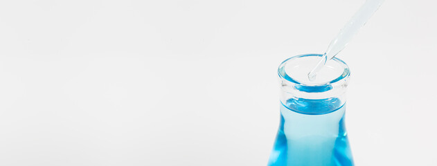 blue liquid pipette and bottle see lab images,Genetic research and Biotech science Concept. Human...