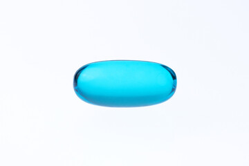 macro shot blue gel tab pill on a white background with copy space