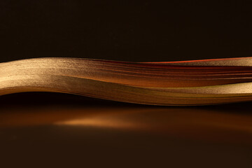 Abstract backgound. Gold (bronze) wave on dark brown.