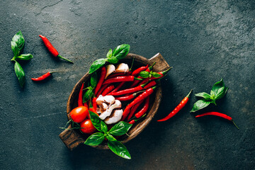 Fresh vegetables in a wooden bowl on a dark background
