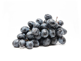 bunch of dark blue grapes isolated on white