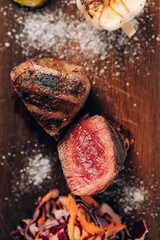 Juicy piece of meat on a wooden board