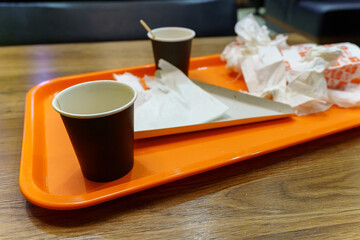 Empty plates. Used dishes are dirty after eating. Food in a fast food restaurant. Selective focus