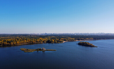 Panoramic aerial view of the forest coast of the sea. Autumn landscape