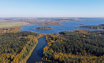 Aerial view of a large river and forest. Autumn panoramic landscape