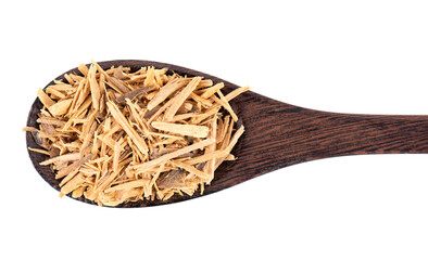 Muira Puama herbal tea in wooden spoon, isolated on white background. Natural potency wood,...