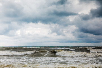Storm clouds over the sea. Dramatic sky and giant waves