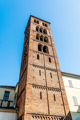 Fototapeta na wymiar The Romanesque bell tower of the Santuario della Consolata a Marian sanctuary and minor basilica built by Guarino Guarini in Baroque style in the 17th century, in Turin, Piedmont region, Italy