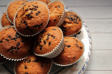 Chocolate chip muffin on white background