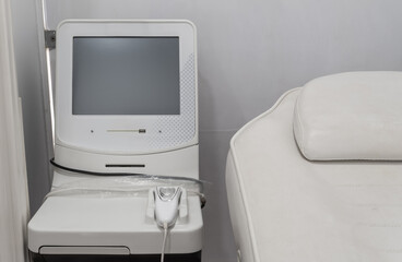 Medical apparatus for ultrasound therapy, massager, in the office of the clinic, for sick patients. Close-up.