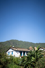 A traditional house situated in the mountains captured during daylight. A traditional house situated in almora.