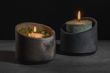 Modern design black ceramic vases with lit candles