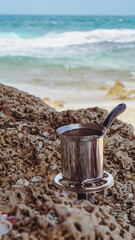 Coffee is made on a gas burner on the beach
