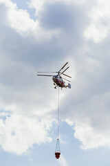 ZHUKOVSKY, RUSSIA - MAY 25, 2021: Multipurpose heavy helicopter Ka-32A11BC (RF-32804) belonging to the Russian Emergencies Ministry extinguishes a fire