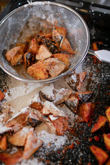 Pieces of eggplant covered with paprika and starch for deep-frying