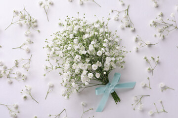 Beautiful bouquet of gypsophila flowers on white background, flat lay