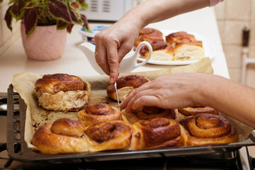 cinnamon rolls buns baking cooking cutting kitchen bakery woman hands preparing sweet candy pastry bread