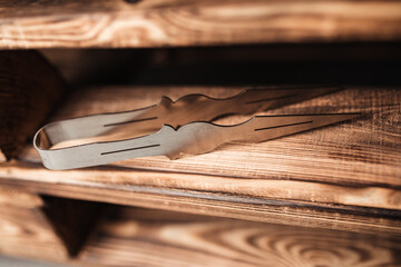 hookah tweezers on wood